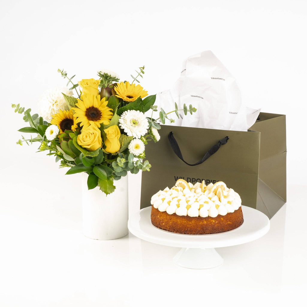 Lemon Curd Posy Cake Gift featuring a citrus cake with piped cream and a vibrant yellow floral posy, ideal for gifting and celebrations.